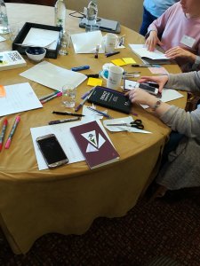 Partipants' notebooks on table 